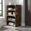 A bathroom shelf unit made of wooden crates, filled with towels, toiletries, and shoes. Náhled obrázku produktu