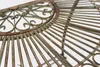 Close-up view of a decorative metal table with a fan-like design. Produktbild-Vorschau