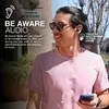 A man is walking outside while wearing earbuds and looking at his phone. Produktbild-Vorschau