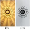 A split image showing a ceiling lamp in two states: on and off. The left side shows the lamp illuminated, casting light patterns on the ceiling. The right side shows the lamp unlit against a plain ceiling. Text labels 'EIN' (ON) and 'AUS' (OFF) are present Produktbild-Vorschau