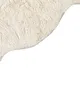 A close-up view of a textured fabric, likely a bath mat, with a curved edge. Náhled obrázku produktu