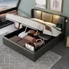 A modern bedroom with a storage bed, showing the bed frame open with items stored inside. Náhled obrázku produktu