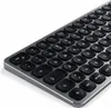A close-up, angled view of a compact, backlit, wireless Bluetooth keyboard. Anteprima dell’immagine prodotto
