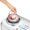 A hand is holding the inner bowl of an ice cream maker filled with pink ice cream. Náhled obrázku produktu