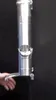 A person's hand is shown reaching towards a silver downspout diverter with a sieve. Produktbild-Vorschau
