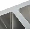 A close-up view of the edge and interior of a stainless steel double sink. Náhľad obrázku produktu