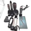 A collection of hair styling attachments and a hair dryer are laid out on a white surface. Anteprima dell’immagine prodotto