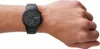A black Emporio Armani watch on a person's wrist. Anteprima dell’immagine prodotto