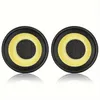 Two black circular speaker drivers with yellow surrounds and black mesh centers, shown from the front with reflections. Produktbild-Vorschau