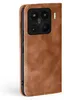 A close-up side view of a brown leather flip case for a smartphone, showing the camera module. Produktbild-Vorschau