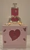 A perfume bottle and its packaging are displayed on a marble surface. Voir les images du produit