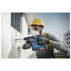 A construction worker is drilling into a wall with a power drill. Produktbild-Vorschau