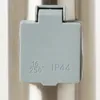 A close-up of an outdoor electrical outlet cover with markings. Anteprima dell’immagine prodotto