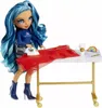 A doll is shown ironing a red dress on an ironing board, with accessories on the table. Produktbild-Vorschau
