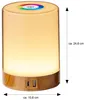 A cylindrical LED table lamp with a wood-effect base and a touch-sensitive top with a color wheel. Produktbild-Vorschau