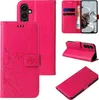 A collage of images showing a pink floral and butterfly patterned flip phone case from different angles, including one showing cards and cash inside. Produktbild-Vorschau