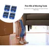 A person is using furniture movers to lift a sofa, with moving boxes in the background. Náhled obrázku produktu