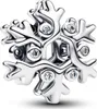 A close-up studio shot of a silver snowflake charm with clear stones. Produktbild-Vorschau