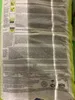 The back of a large bag of building material, likely mortar, with extensive text and diagrams. Produktbild-Vorschau