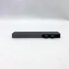 A dark gray USB-C hub is centered on a white and light gray textured surface. Produktbild-Vorschau
