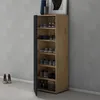A tall, narrow shoe cabinet with a wooden front and a dark gray side is shown in a room with a gray wall and white floor. Shoes are neatly organized on the shelves inside. Voir les images du produit