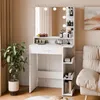 A white vanity table with a mirror and LED lights, decorated with various cosmetic products and a plant. Produktbild-Vorschau