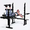 A woman is using a weight bench for a leg exercise. Podgląd zdjęcia produktu