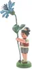 A figurine of a boy holding a blue cornflower. Produktbild-Vorschau