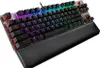 A close-up, angled view of a black mechanical keyboard with RGB backlighting and a black wrist rest. Produktbild-Vorschau