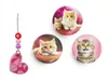 A collection of cat-themed accessories, including three round pins and a heart-shaped charm with beads. Produktbild-Vorschau