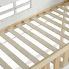 Close-up view of the wooden slats of a bed frame, with a white headboard in the background. Anteprima dell’immagine prodotto