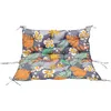 A colorful cushion with a tropical leaf and flower pattern, shown flat against a white background. Voir les images du produit