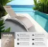A lounge chair by a swimming pool with a view of the ocean. Produktbild-Vorschau