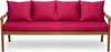 A studio shot of a wooden bench with pink cushions.