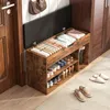 A shoe cabinet with storage and seating in a hallway next to a door and a closet. Náhled obrázku produktu