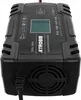 A close-up front view of a black battery charger. Náhled obrázku produktu
