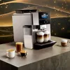A Siemens coffee machine with multiple cups of coffee and a milk container. Anteprima dell’immagine prodotto