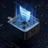 A black USB-C wall charger with a glowing blue overlay showing circuit board details and the text 'SUPERIOR SAFETY'. The charger is placed on a dark, textured background resembling a circuit board. Anteprima dell’immagine prodotto