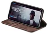 A brown flip case for an iPhone is shown open, displaying the phone's screen which shows a movie poster for 'The Inspector'. Produktbild-Vorschau