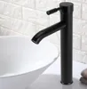 A black faucet is installed above a white sink, with a white brick-patterned wall in the background. Anteprima dell’immagine prodotto