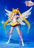 A Sailor Moon action figure with wings, posed against a blue, starry background. Produktbild-Vorschau