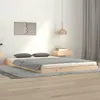 A bedroom scene with a wooden bed frame, mattress, pillows, and a rug. Náhľad obrázku produktu