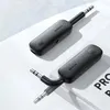 Two black Ugreen Bluetooth receivers with 3.5mm jack connectors are displayed on a light gray and white surface. Anteprima dell’immagine prodotto