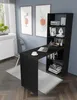 A black desk with an attached bookshelf in a room with blue walls and artwork. Voir les images du produit