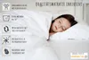 A young girl sleeping peacefully in a white bed, with informational graphics on the left side. Produktbild-Vorschau