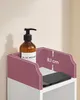 Close-up of a shelf with a dispenser and a smartphone, with dimensions indicated. Náhled obrázku produktu