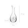 A clear studio shot of a glass carafe with dimensions indicated by text overlays. Produktbild-Vorschau