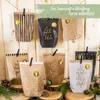 A collection of decorated paper bags arranged on a wooden background, resembling an advent calendar. Náhľad obrázku produktu