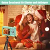 A family in Santa hats taking a photo with a digital camera during Christmas. Produktbild-Vorschau