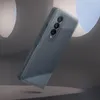 A smartphone case is shown in a dynamic, floating pose against a textured, abstract background. Náhled obrázku produktu
